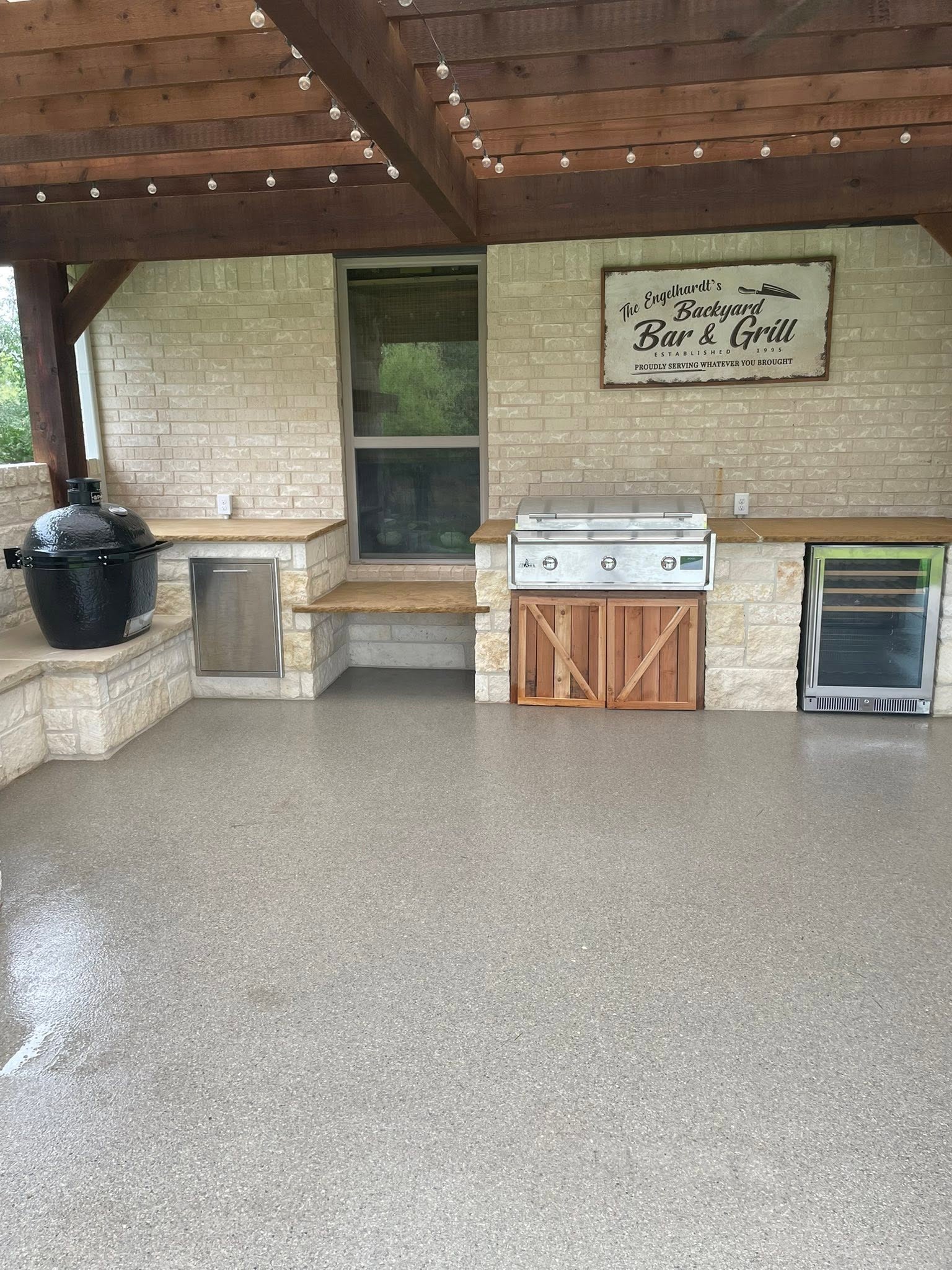 Outdoor kitchen with storage drawers and access doors